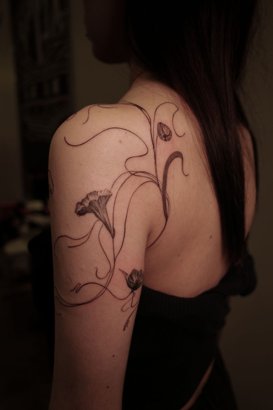 Free-hand botanical tattoo by Dasha Chau