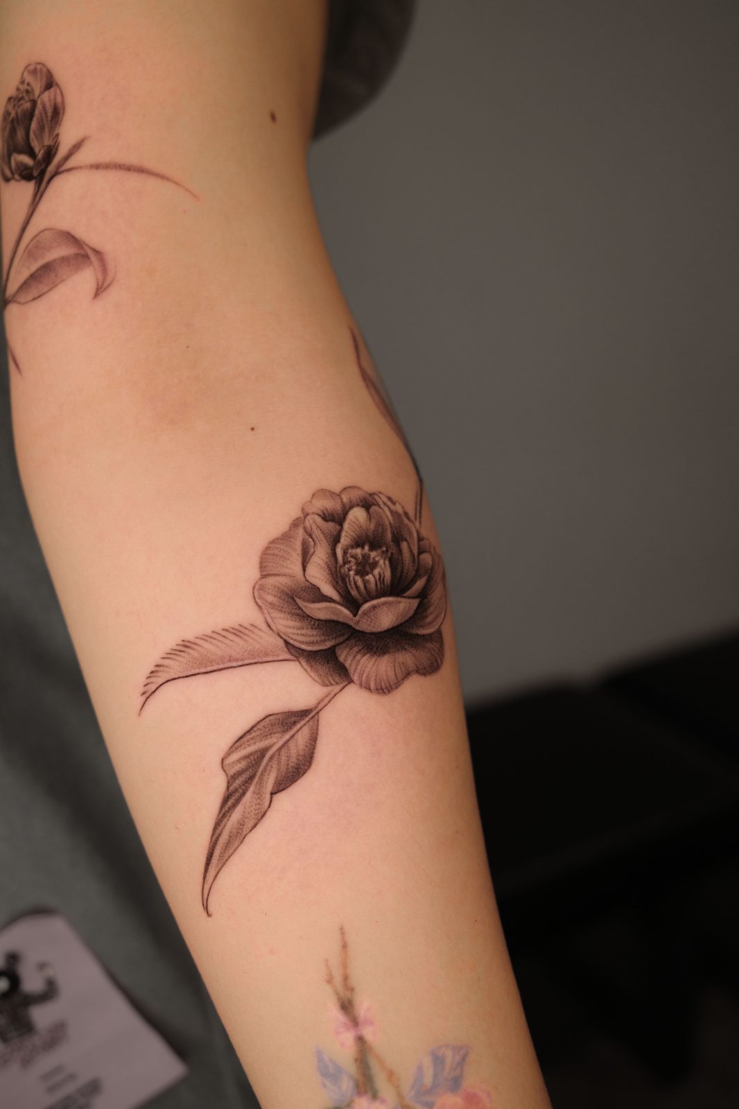 Free-hand botanical tattoo by Dasha Chau